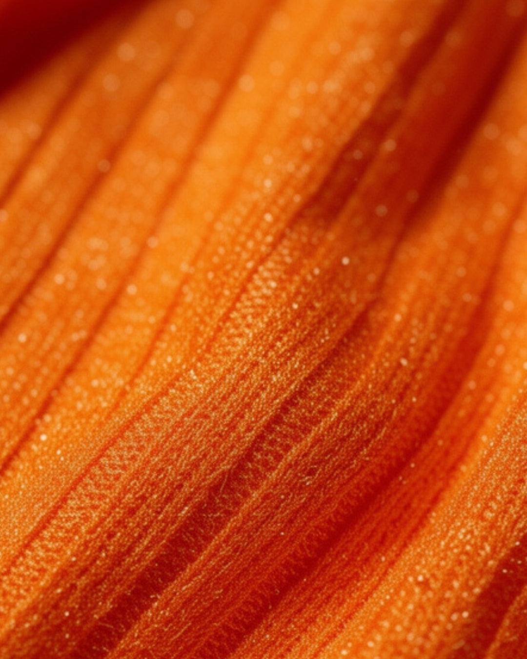 Valira — set naranja con textura lineal y falda midi