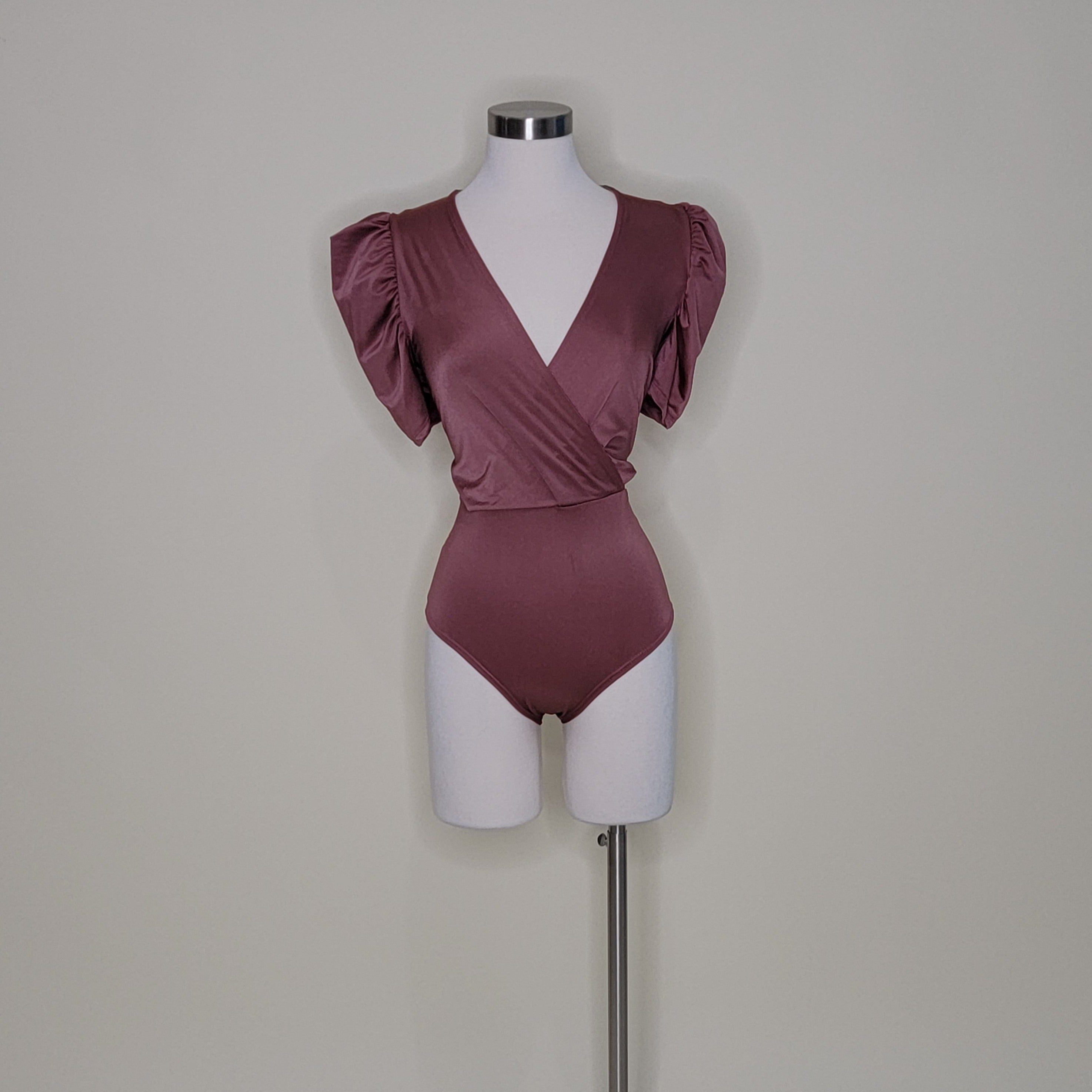 bodysuit satén
bodysuit escote en V
bodysuit manga puff
ropa elegante mujer
bodysuit talla única
bodysuit chic
ropa satinada
bodysuit para fiesta
GV Boutique bodysuit
bodysuit mujer