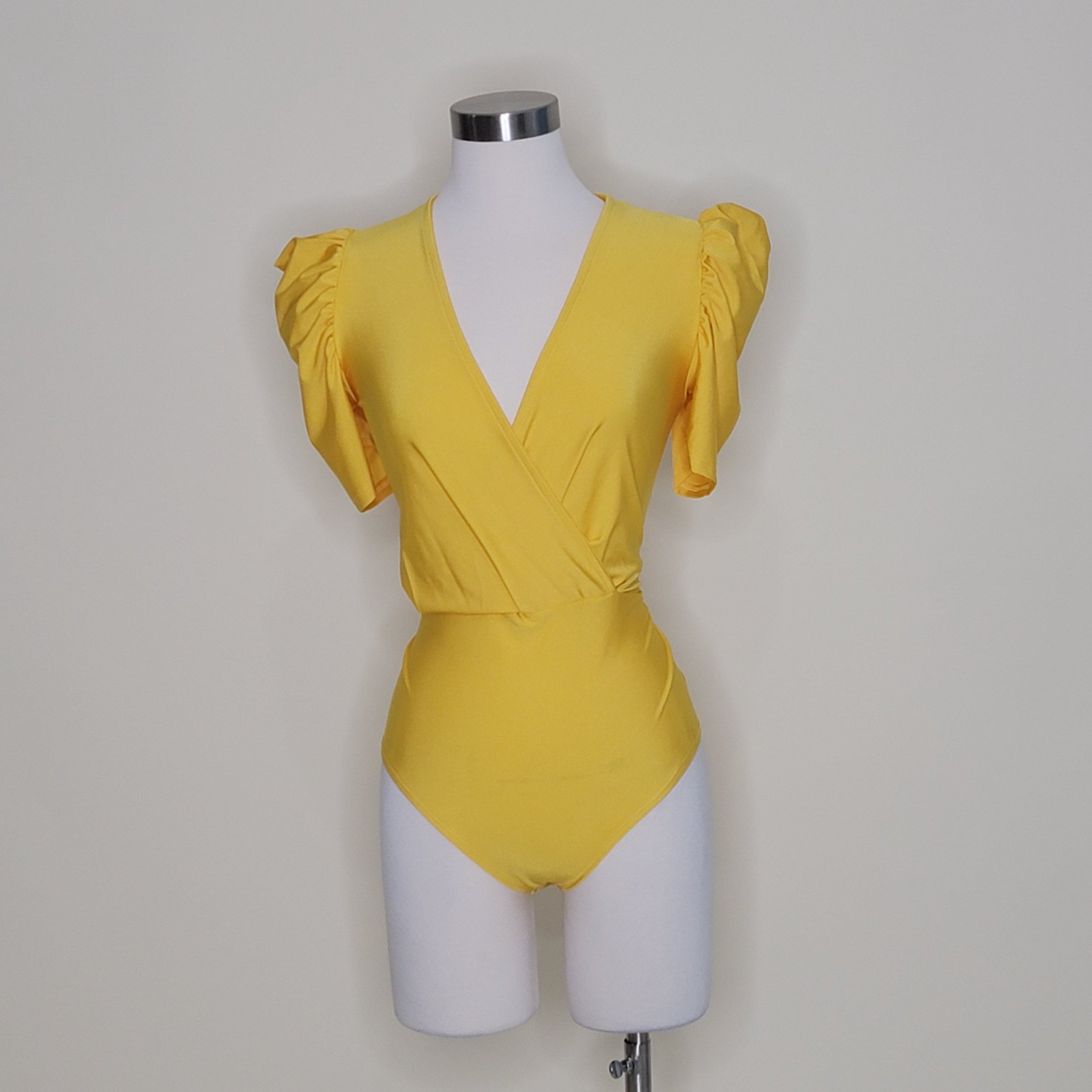 bodysuit satén
bodysuit escote en V
bodysuit manga puff
ropa elegante mujer
bodysuit talla única
bodysuit chic
ropa satinada
bodysuit para fiesta
GV Boutique bodysuit
bodysuit mujer