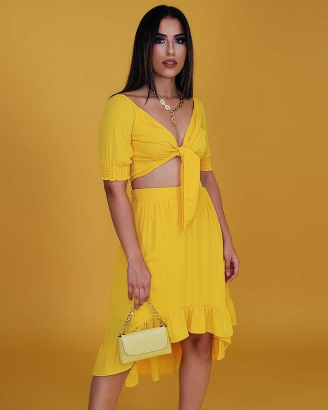 Solène — conjunto de dos piezas con top de lazo y falda midi con volantes
