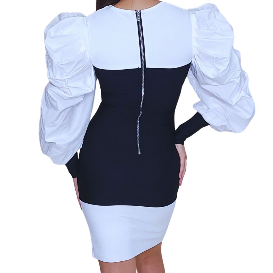 vestido corset bicolor
vestido blanco y negro
ropa elegante mujer
vestido con mangas abullonadas
vestido con abertura lateral
moda premium boutique
vestido formal chic
outfit noche sofisticado
estilo GV exclusivo
moda femenina estructurada