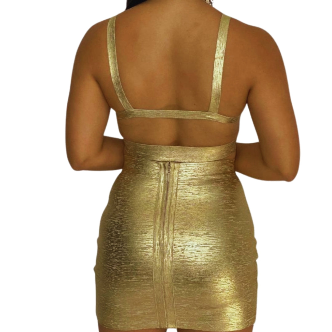 conjunto dorado
set dos piezas
falda mini dorada
crop top cruzado
ropa de fiesta
outfit glam
moda elegante
ropa para eventos
GV Boutique
look de impacto