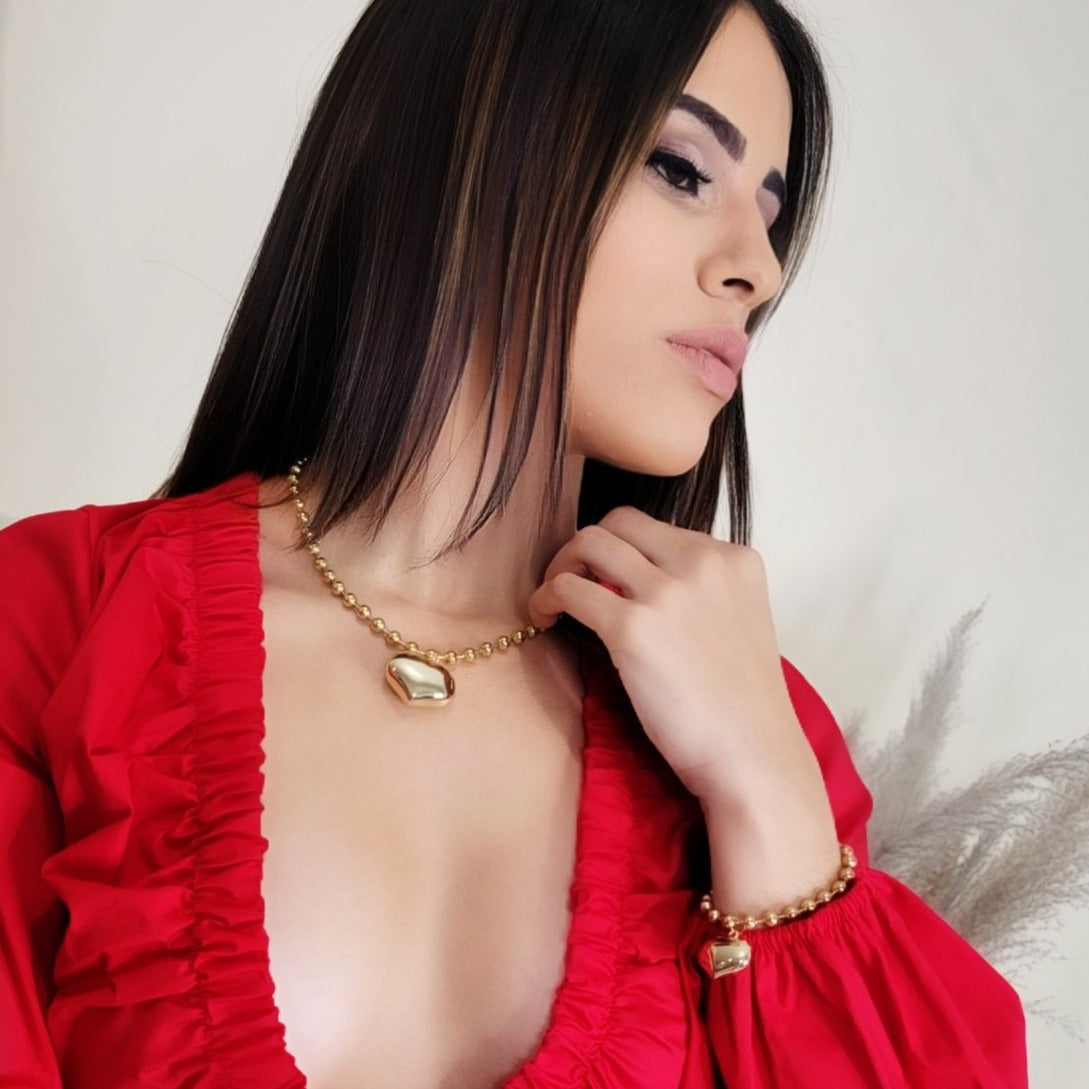 set de collar y pulsera
accesorios elegantes mujer
collar con encanto de corazón
pulsera y collar coordinados
accesorios románticos chic
joyería femenina importada
set de accesorios dorados
regalo elegante mujer
accesorios versátiles
joyería con estilo
