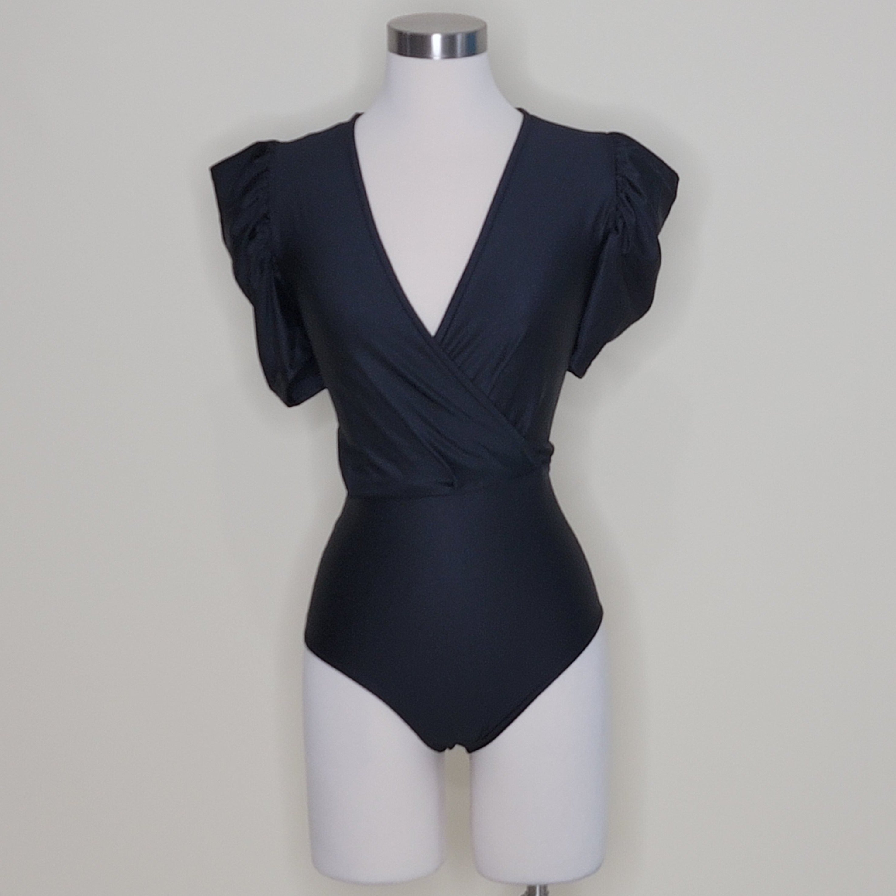 bodysuit satén
bodysuit escote en V
bodysuit manga puff
ropa elegante mujer
bodysuit talla única
bodysuit chic
ropa satinada
bodysuit para fiesta
GV Boutique bodysuit
bodysuit mujer 