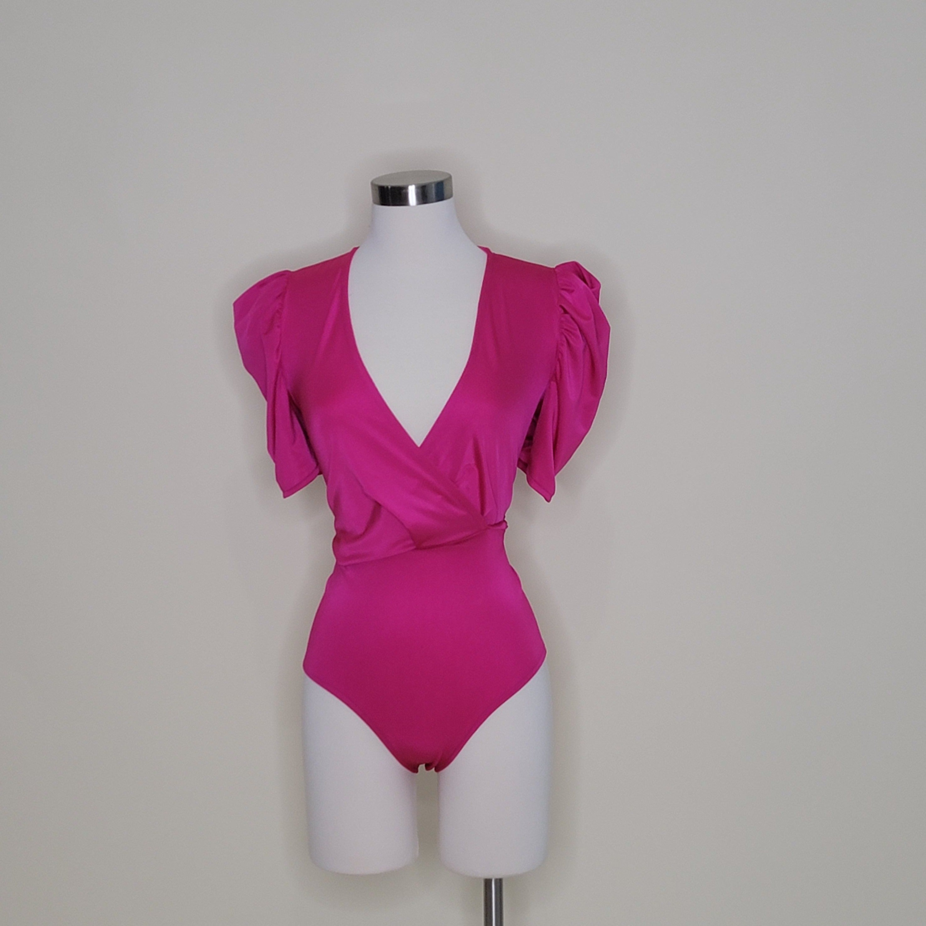 bodysuit satén
bodysuit escote en V
bodysuit manga puff
ropa elegante mujer
bodysuit talla única
bodysuit chic
ropa satinada
bodysuit para fiesta
GV Boutique bodysuit
bodysuit mujer 
